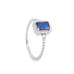 White gold  ring with a blue gemstone