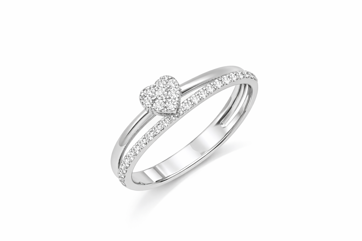 White gold ring with heart-shaped center and diamond accent