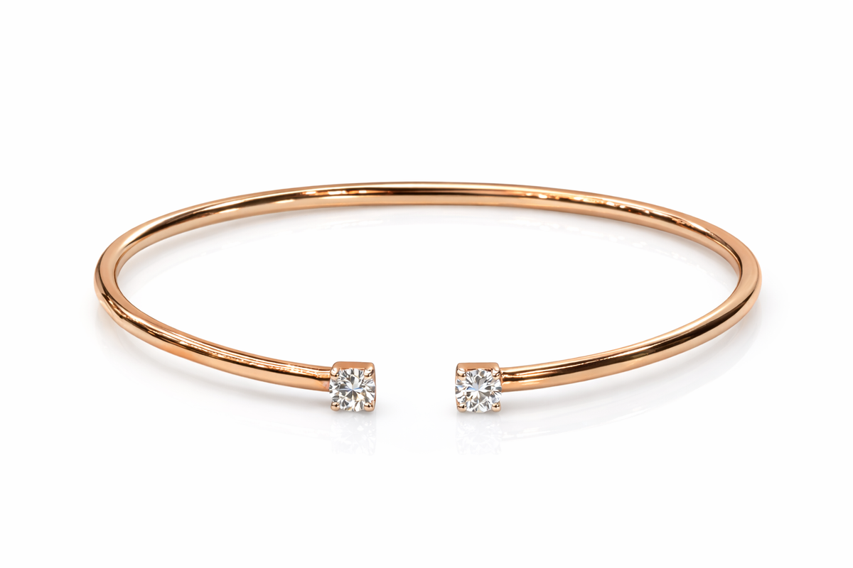 Rose gold bangle with two small diamonds