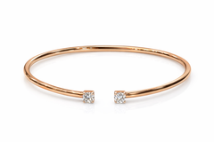 Rose gold bangle with two small diamonds